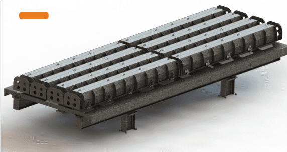 Moldes Andescol para bordillos y postes de concreto sobre mesa vibratoria